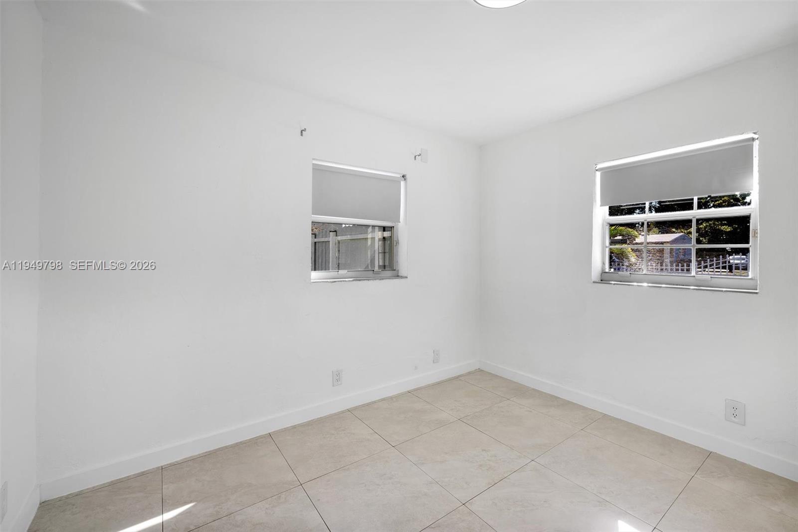 6231 Mayo Street Hollywood, FL 33023 - Photo 12 of 34 an empty room with windows