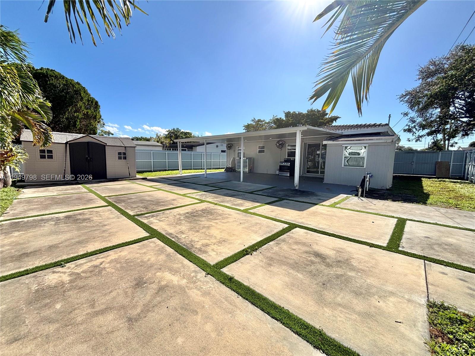 6231 Mayo Street Hollywood, FL 33023 - Photo 18 of 34 a view of a house with a backyard