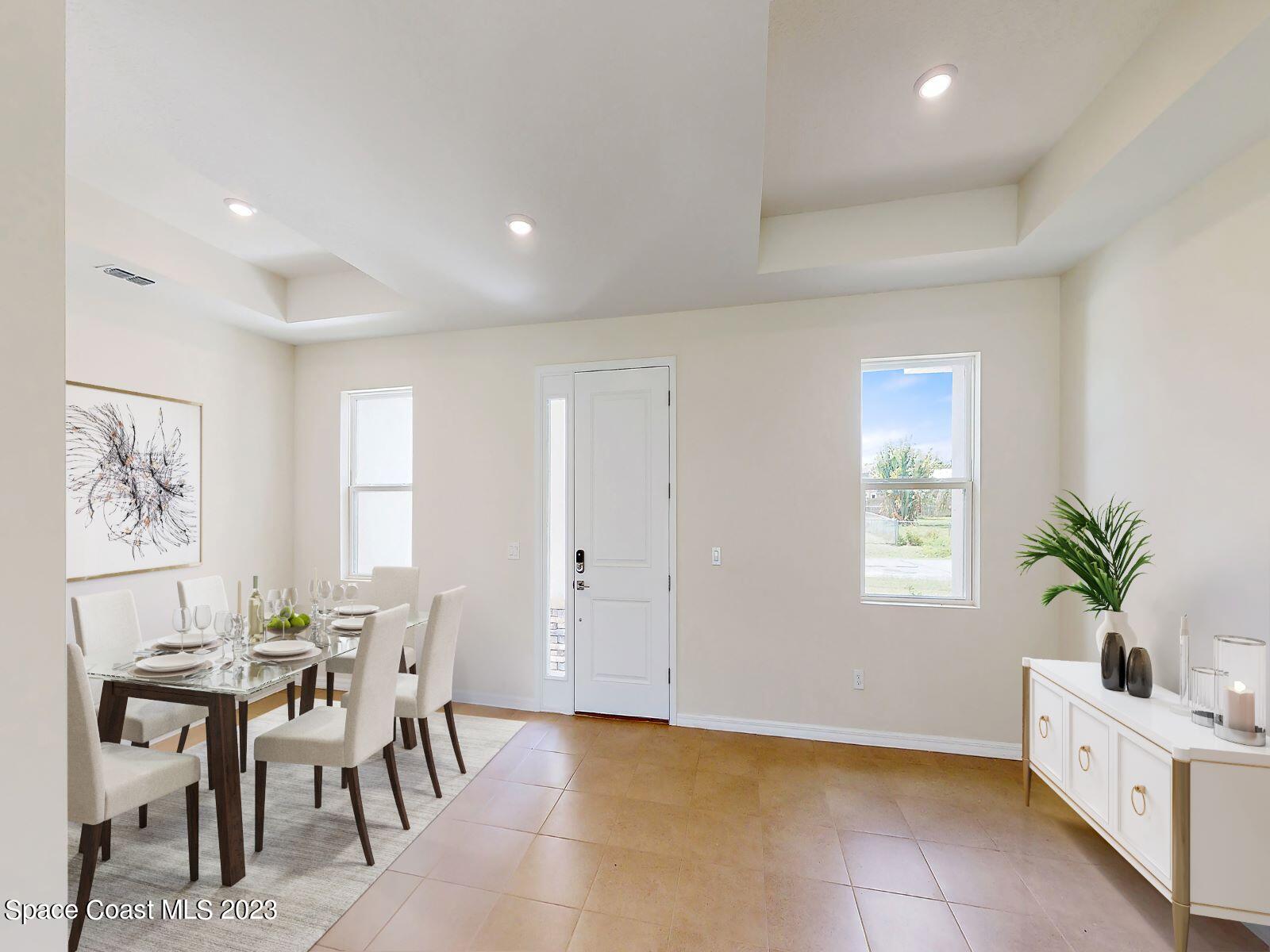 467 Scarlet Road Southwest Palm Bay, FL 32908 - Photo 2 of 18 004_virtual staged foyer dining rm