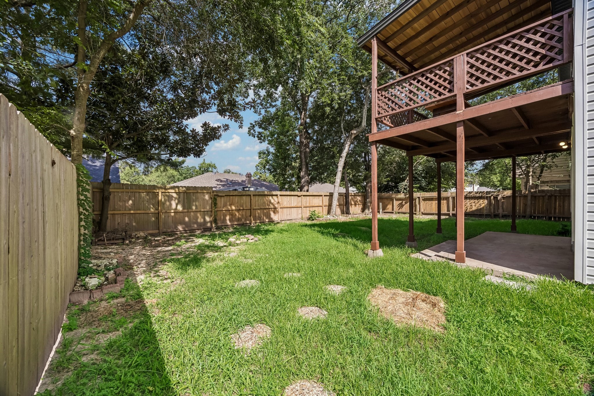 23319 Whispering Willow Drive Spring, TX 77373 - Photo 5 of 31 Backyard oasis with Dual level covered outdoor patios.