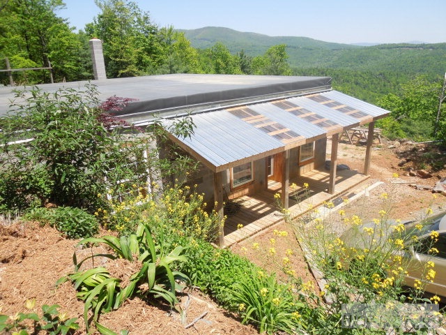 a view of an outdoor space with lounge chair