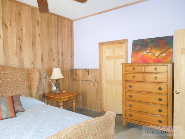 3086 Summit Road Purlear, NC 28665 - Photo 11 of 13 a bedroom with a bed and furniture