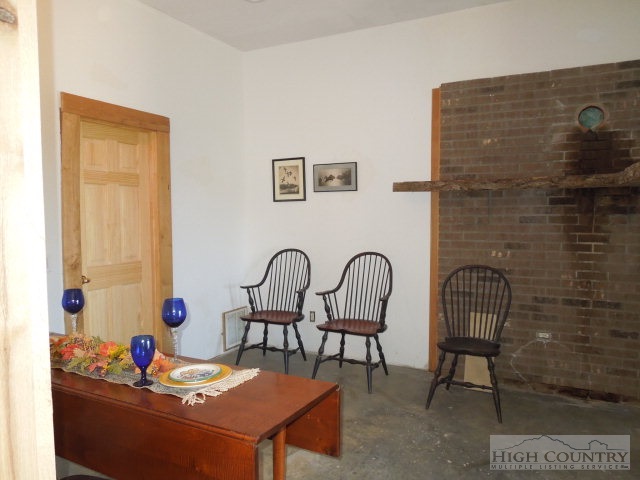 3086 Summit Road Purlear, NC 28665 - Photo 8 of 13 a bedroom with a table chairs and a bed