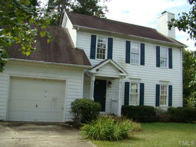 6012 Eaglesfield Drive Raleigh, NC 27613 - Photo 1 of 9 a front view of a house with garden