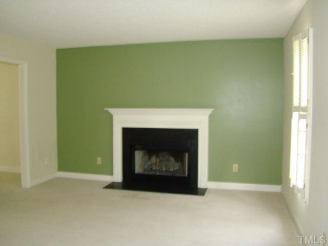 6012 Eaglesfield Drive Raleigh, NC 27613 - Photo 3 of 9 a room with a fireplace