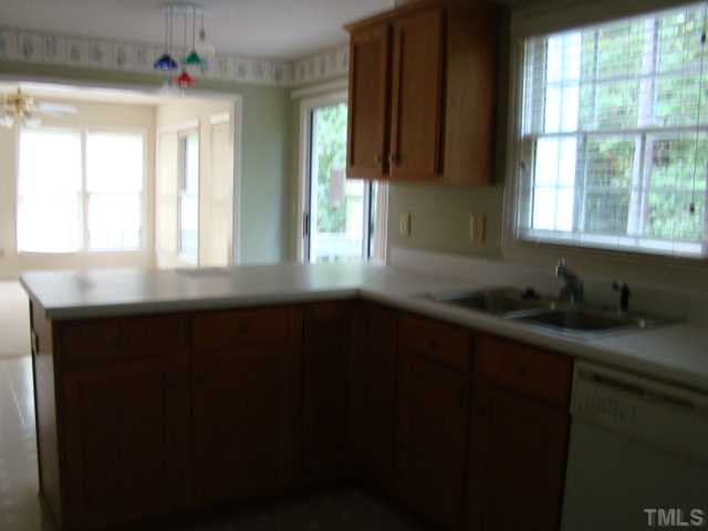 6012 Eaglesfield Drive Raleigh, NC 27613 - Photo 6 of 9 a kitchen with a window a sink and a window