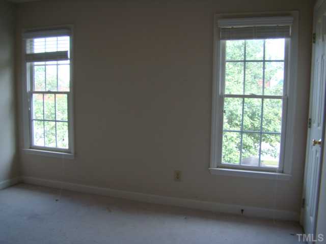 6012 Eaglesfield Drive Raleigh, NC 27613 - Photo 8 of 9 an empty room with a window