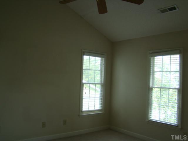 6012 Eaglesfield Drive Raleigh, NC 27613 - Photo 9 of 9 a view of an empty room with a window