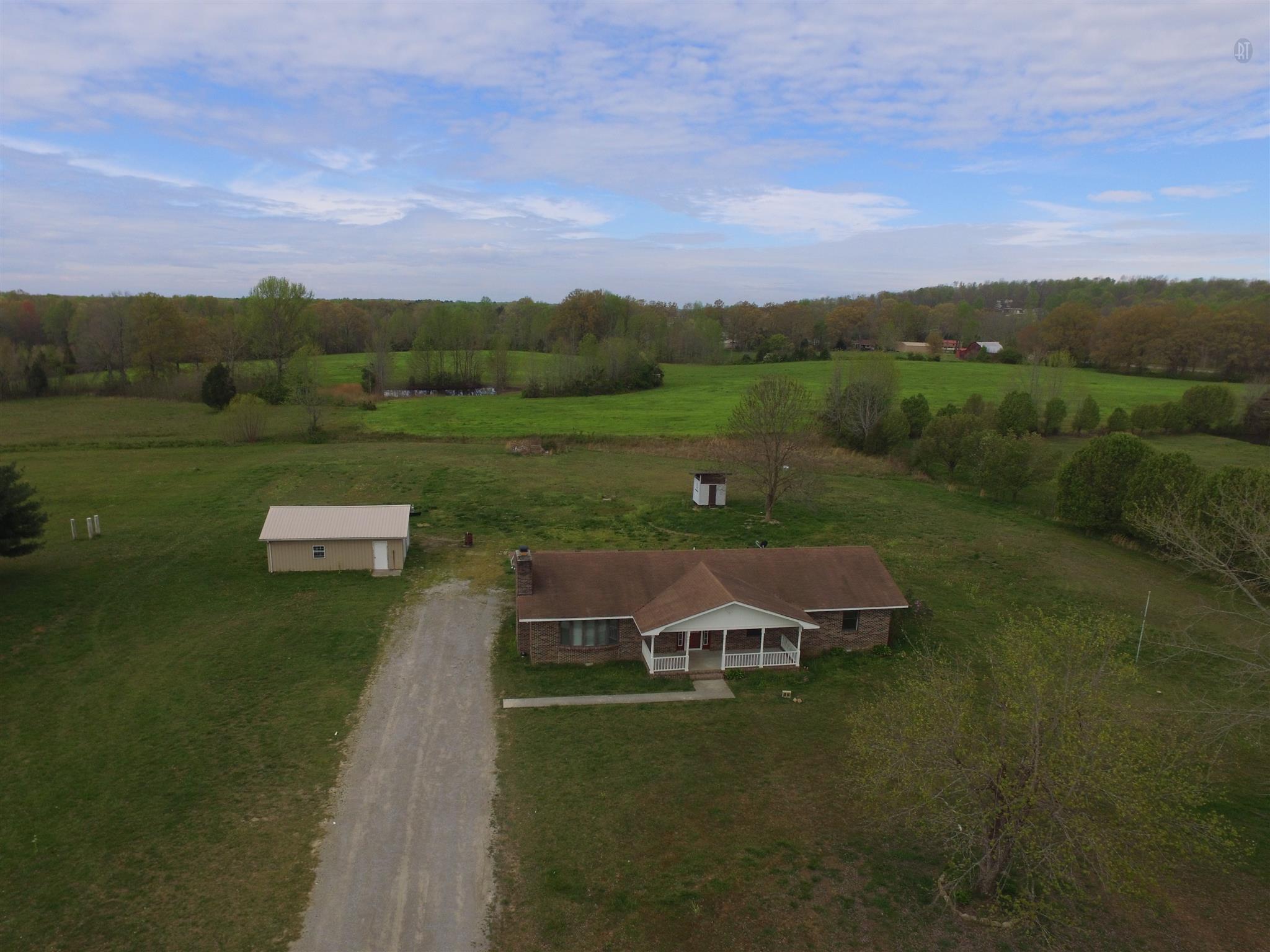966 Ramsey Road Morrison, TN 37357 - Photo 22 of 28 Country living! Only minutes to town and interstate I-24. This 3 bedroom, 2 bath brick home with fireplace sits on 3 acres. The home has an attached carport and a large 2 car detached garage with side storage.