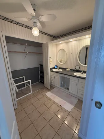 a kitchen with a refrigerator and a sink