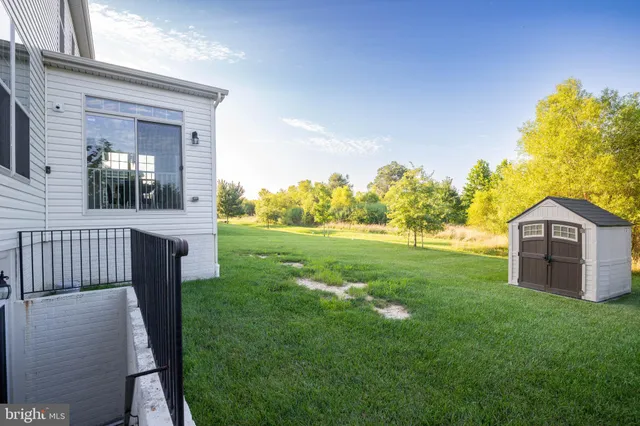 a view of a front of a house with a yard