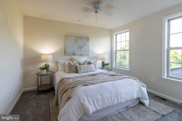 a bedroom with bed and window