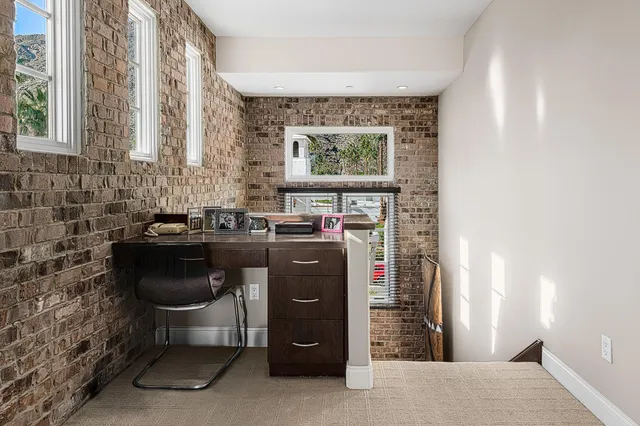 a view of a kitchen with a sink and cabinets