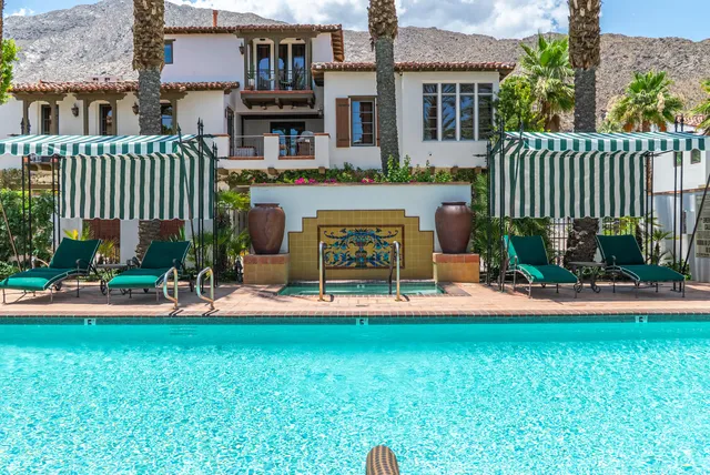 a front view of house with yard and outdoor seating
