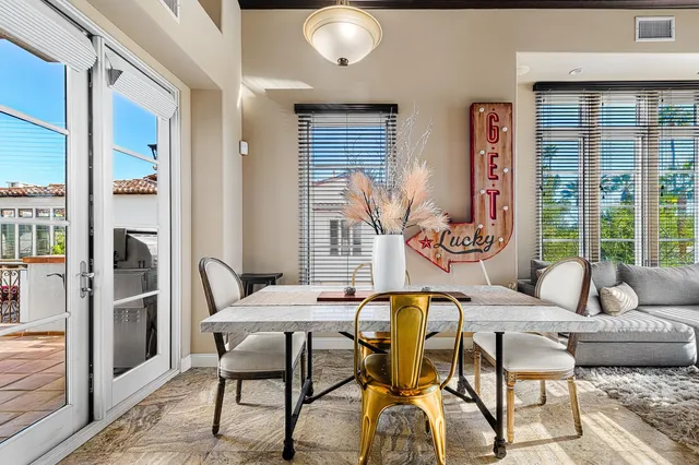 a dining room with furniture and window
