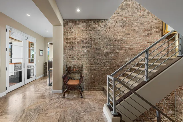 a view of an entryway with wooden floor