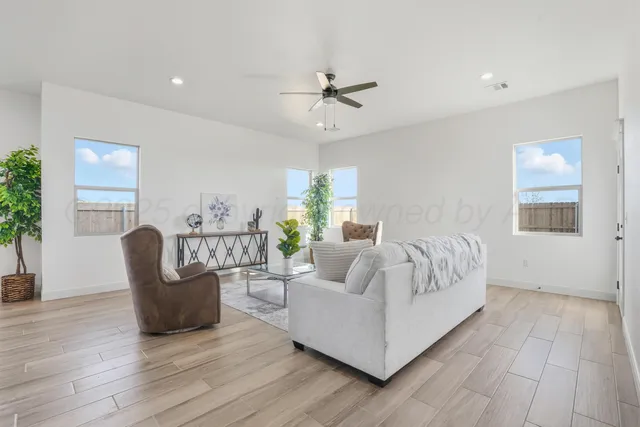 a living room with furniture and a large window