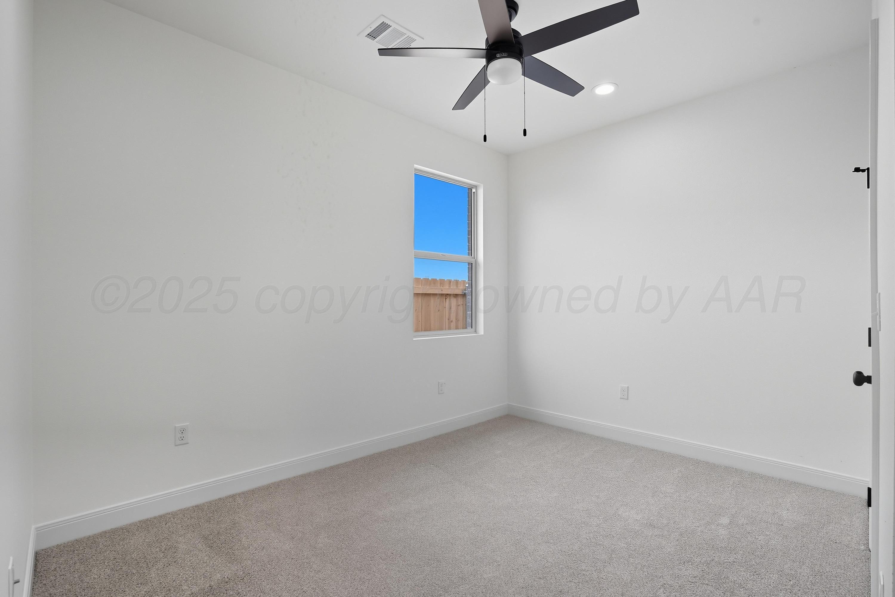 8 Gagestone Drive Canyon, TX 79015 - Photo 6 of 11 an empty room with a window and a fan