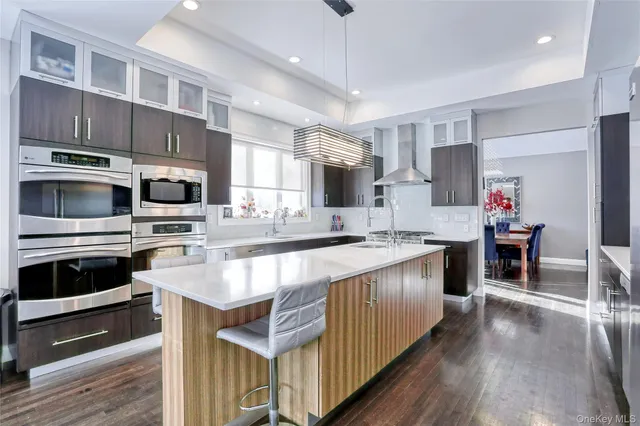 a kitchen with stainless steel appliances granite countertop a stove and cabinets