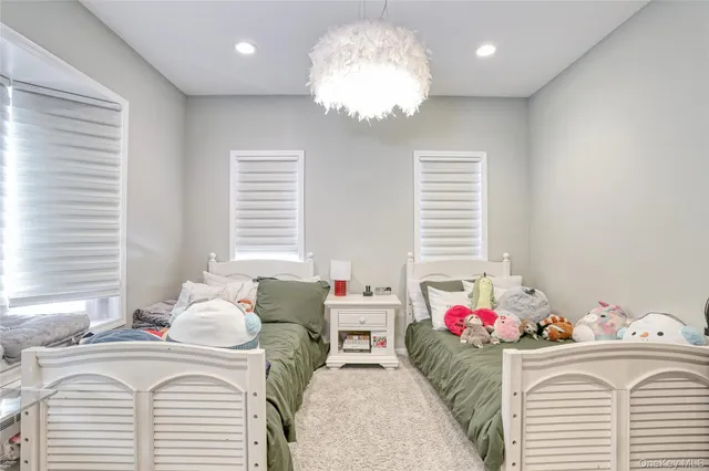 a bedroom with furniture and a bed