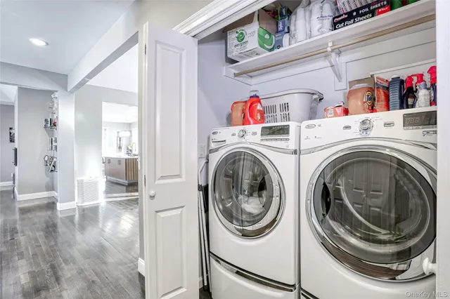 a view of a hallway with washer and dryer