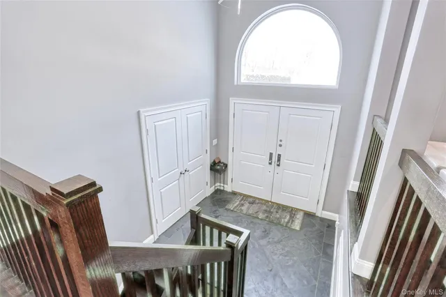 a view of a livingroom with wooden floor and white walls