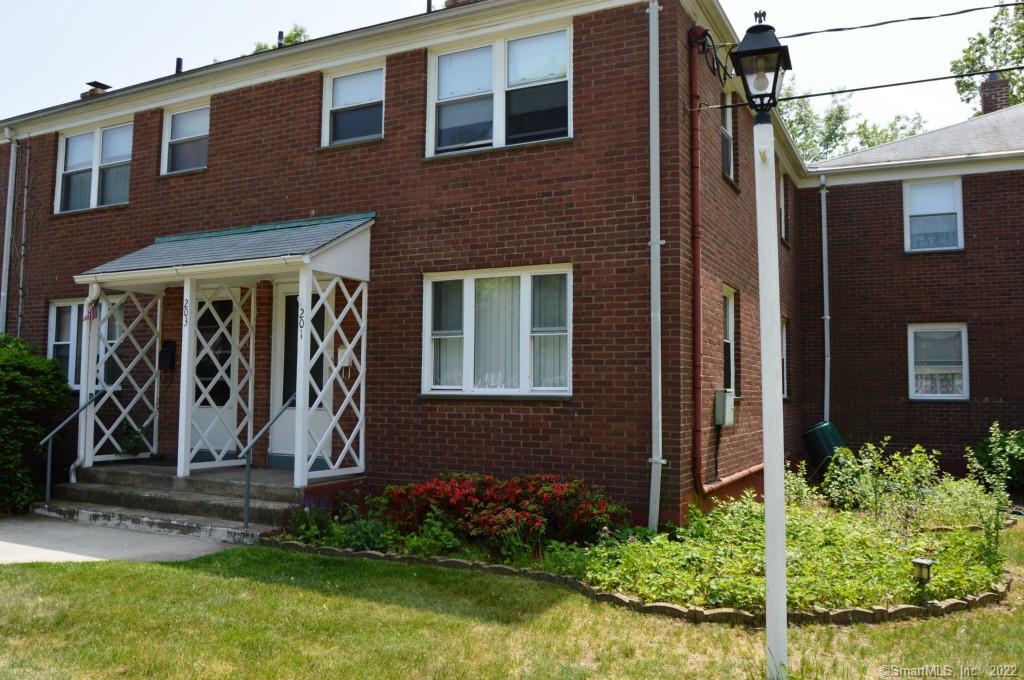 201 Franklin Road, Unit 201 Hamden, CT 06517 - Photo 1 of 1 a front view of a house with garden