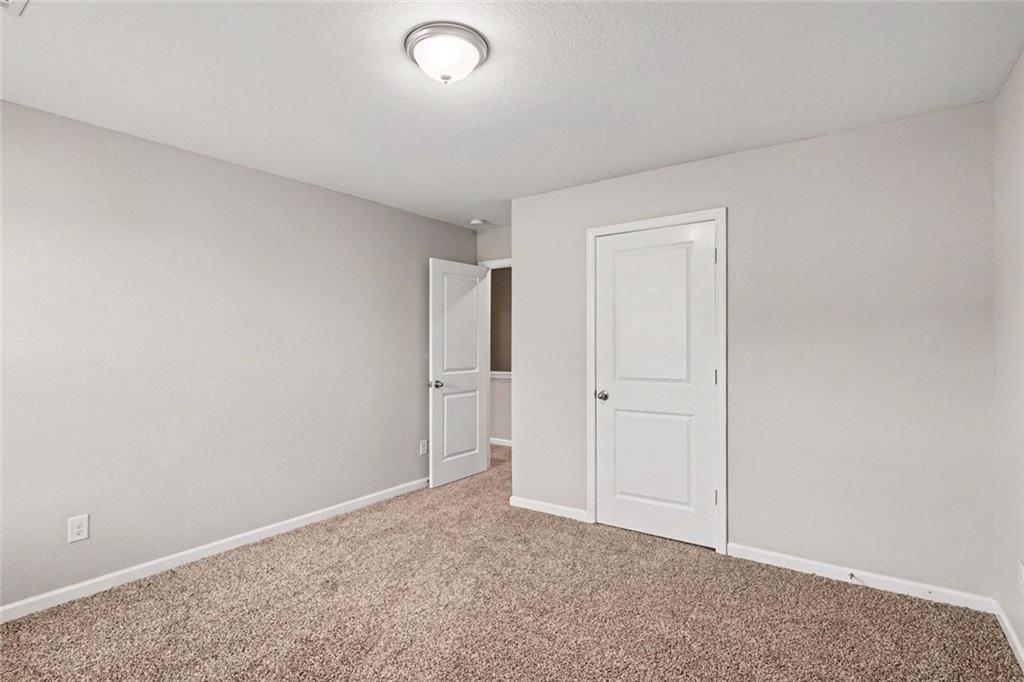 10941 Wheeler Trace Hampton, GA 30228 - Photo 14 of 21 a view of an empty room