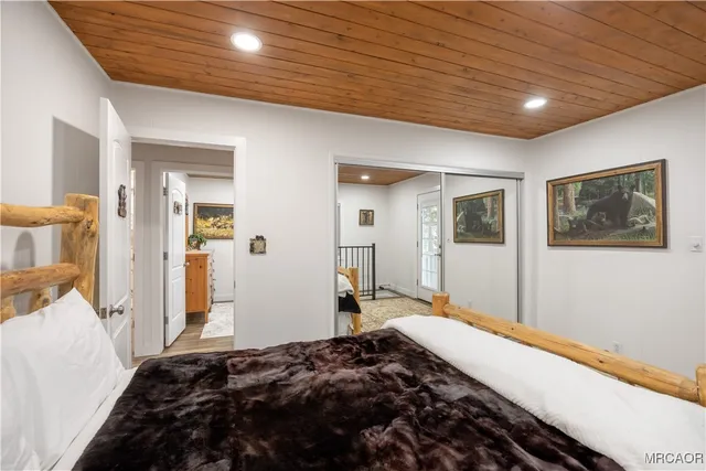 a bedroom with bed and a window