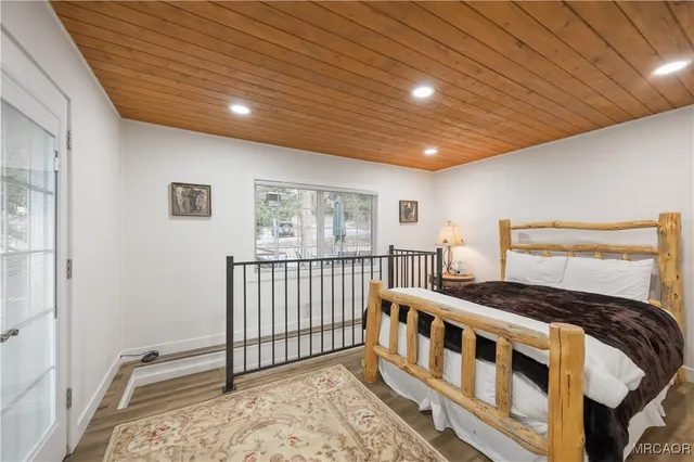 a view of a patio with table and chairs and wooden floor