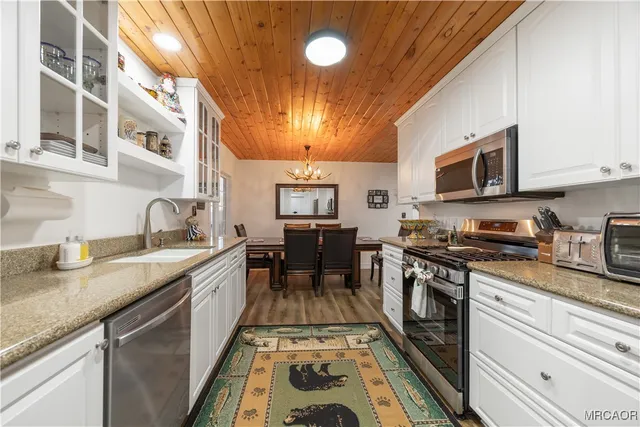 a bedroom with a bed next to a window