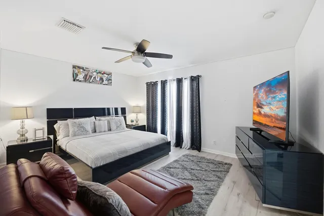 a bathroom with a shower toilet and sink