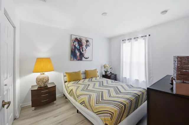 a view of a yard with wooden fence