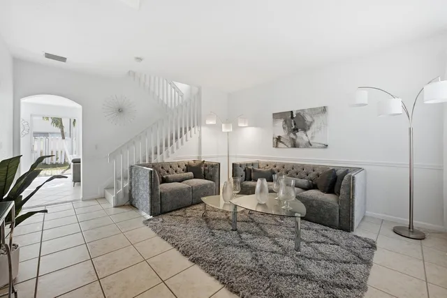 a kitchen with refrigerator and cabinets