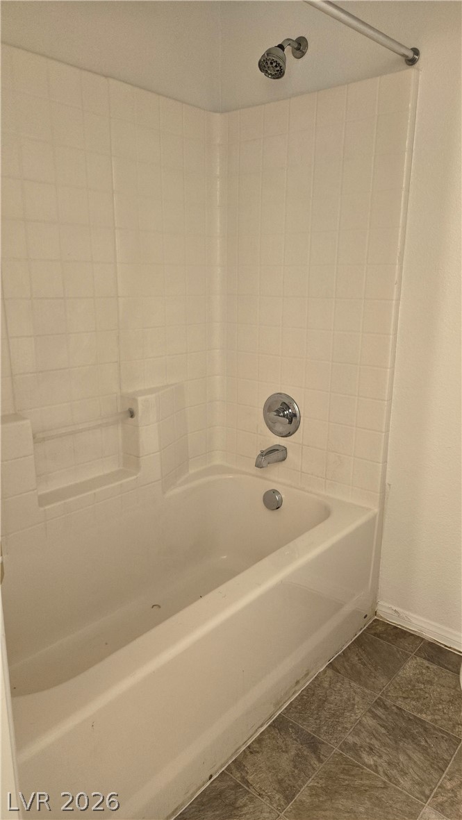 9031 Spring Star Court Las Vegas, NV 89148 - Photo 16 of 17 A classic bathtub and shower combination for everyday routines.