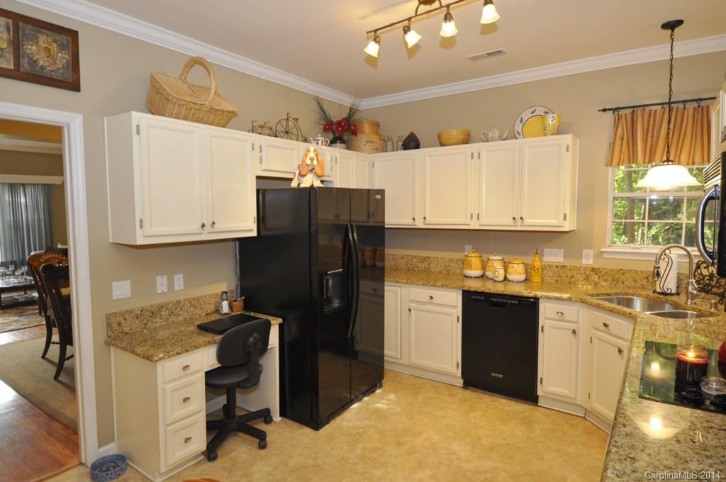 6149 Park Hill Road Charlotte, NC 28277 - Photo 2 of 20 a kitchen with stainless steel appliances a refrigerator sink and cabinets