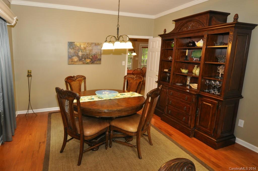6149 Park Hill Road Charlotte, NC 28277 - Photo 5 of 20 a view of a dining room with furniture and wooden floor