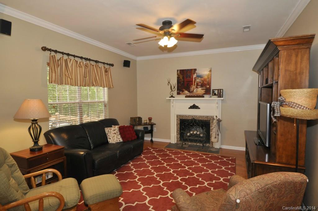 6149 Park Hill Road Charlotte, NC 28277 - Photo 7 of 20 a living room with furniture and a fireplace