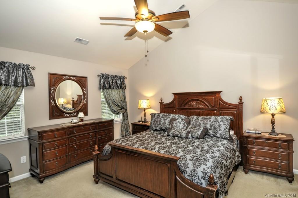 6149 Park Hill Road Charlotte, NC 28277 - Photo 9 of 20 a bedroom with a bed and a dresser