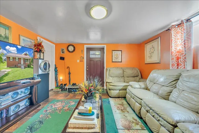 a living room with furniture and a rug