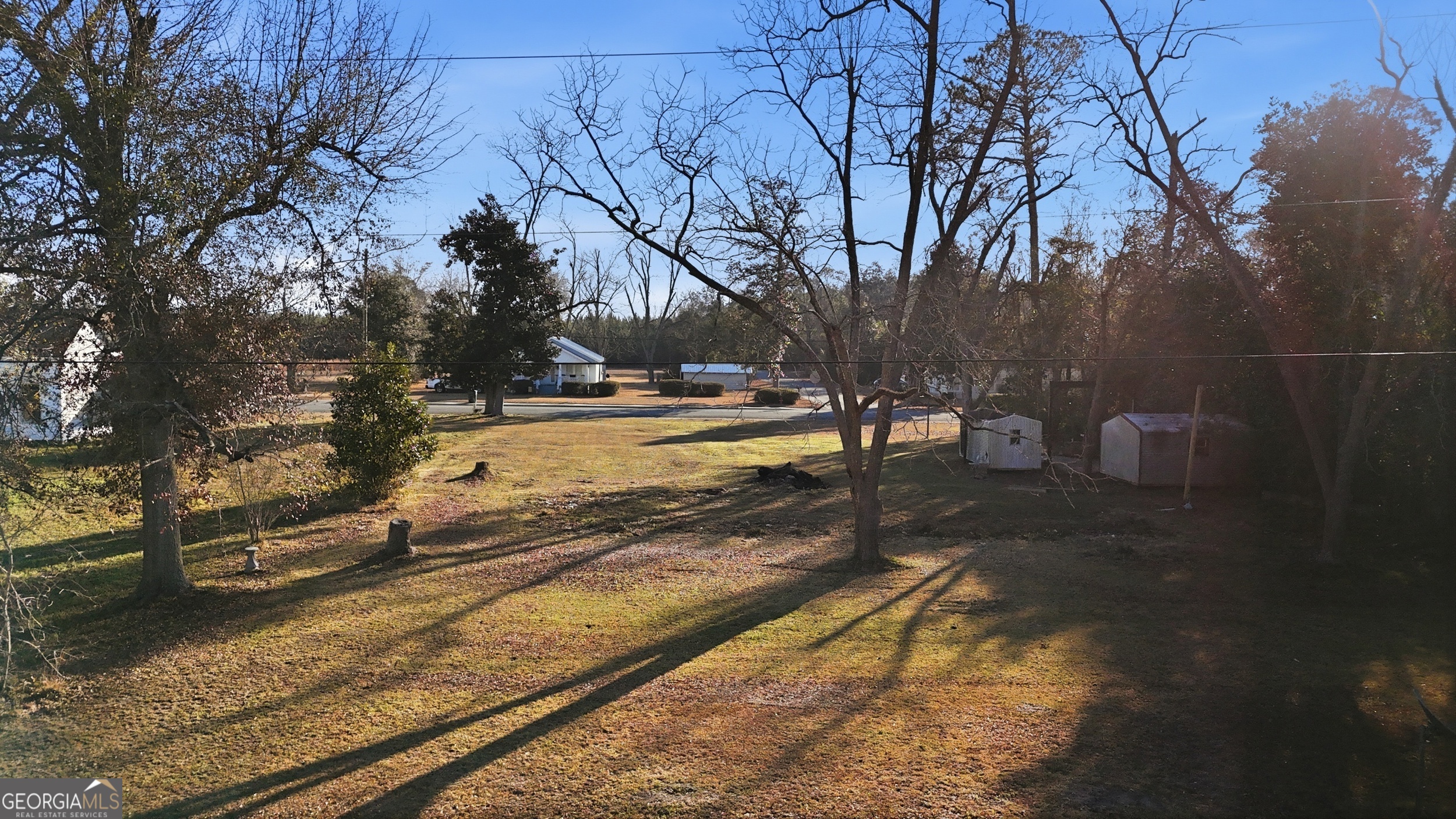 273 South Main Street Pembroke, GA 31321 - Photo 11 of 22 a view of a yard with trees