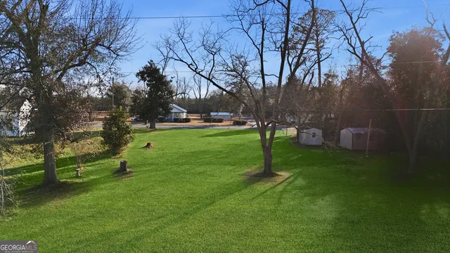 an aerial view of houses with outdoor space