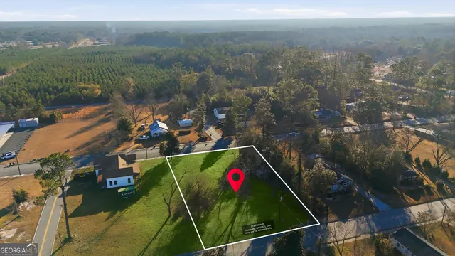an aerial view of houses with outdoor space
