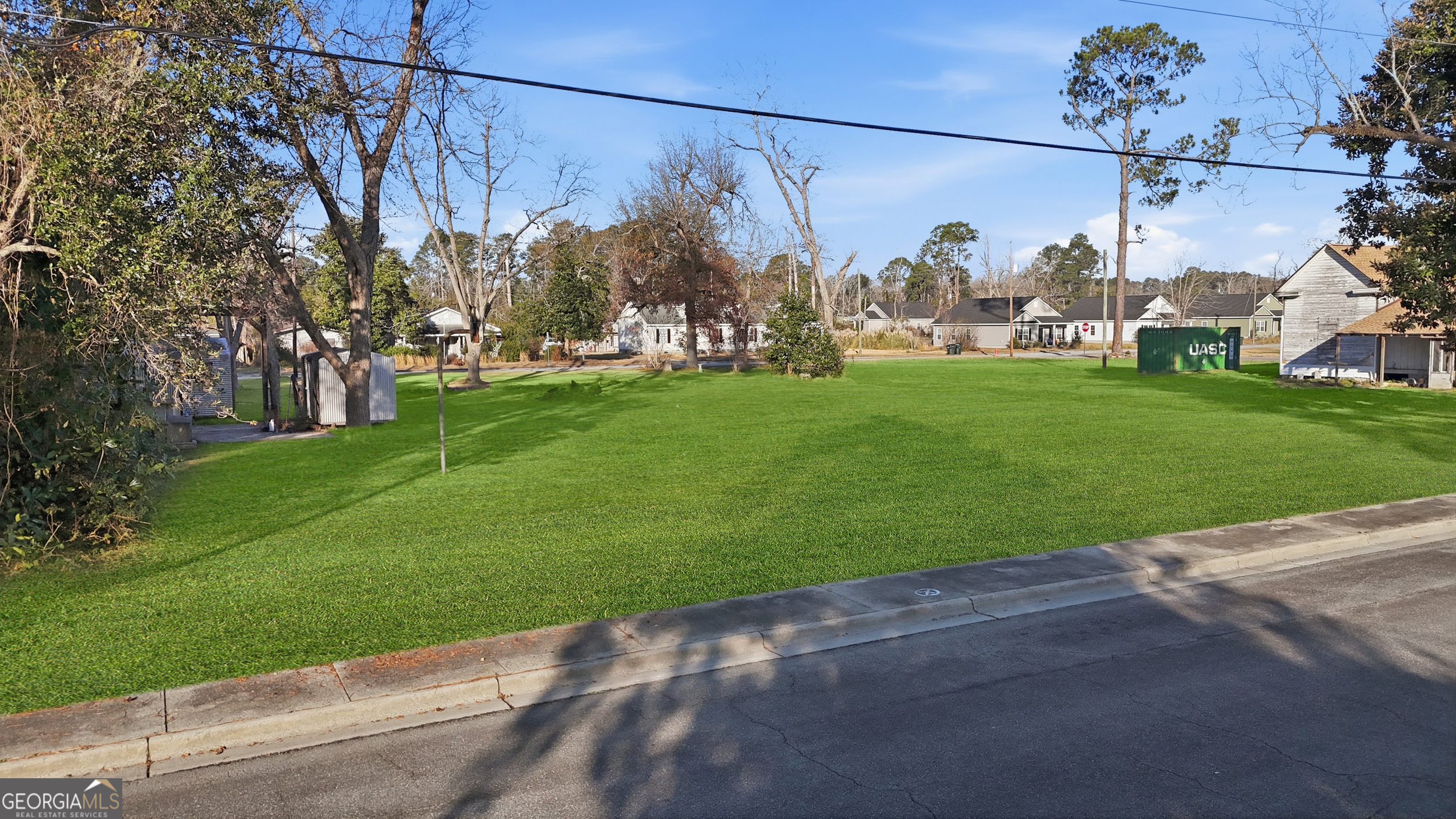 273 South Main Street Pembroke, GA 31321 - Photo 22 of 22 a view of a street with a building and a street view