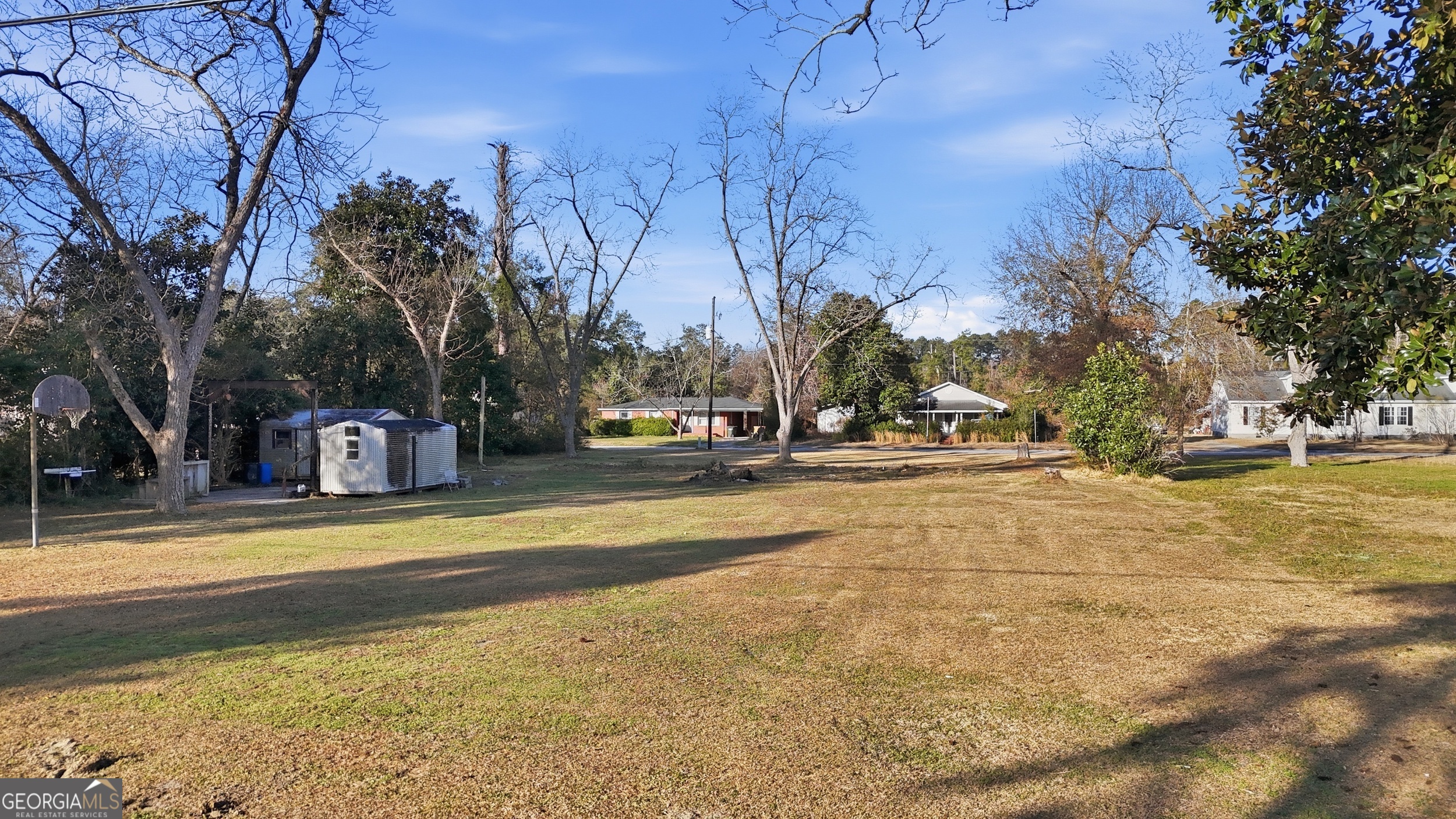 273 South Main Street Pembroke, GA 31321 - Photo 10 of 22 a view of a swimming pool with trees