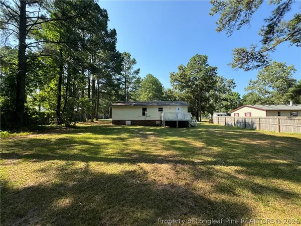a view of a house with a big yard