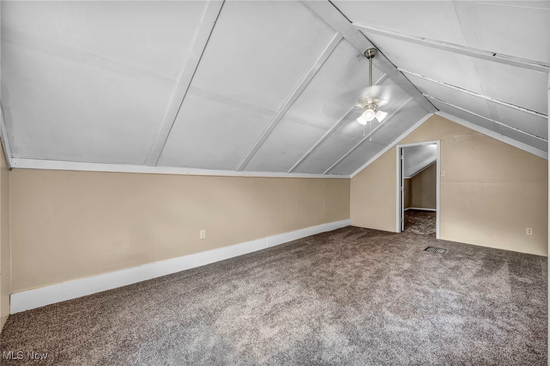 1425 Keefer Road Girard, OH 44420 - Photo 22 of 37 Additional living space featuring carpet, lofted ceiling, and a ceiling fan