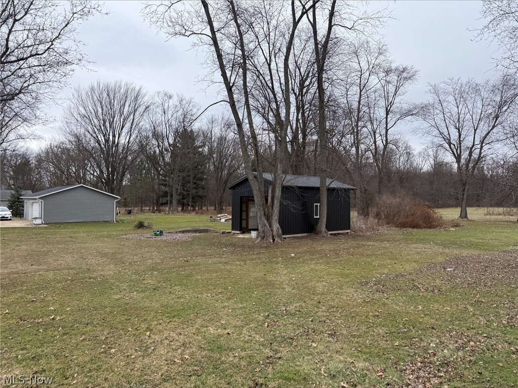 888 Beal Road Mansfield, OH 44905 - Photo 5 of 5 View of green lawn featuring an outbuilding