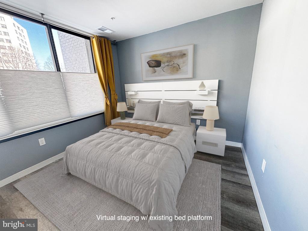 700 Roeder Road, Unit 103 Silver Spring, MD 20910 - Photo 13 of 21 Modern bedroom with serene color palette.