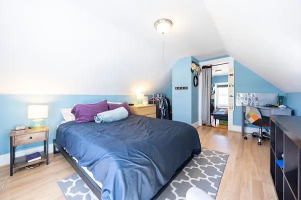 a bedroom with a bed and a table